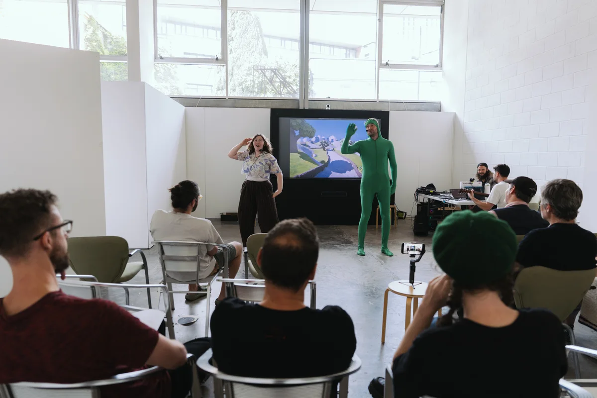 Sheffield friends watch an early Pixel Puppets sharing, with the performers, musicians and digital world together in the rehearsal room.